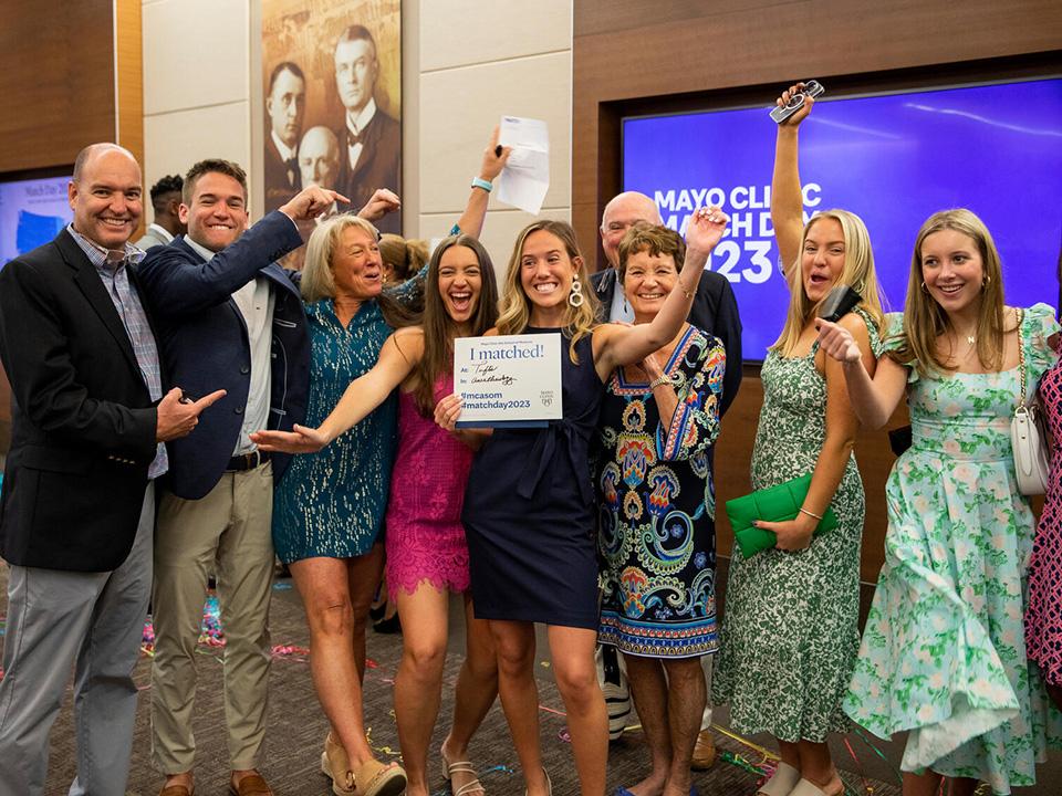A med student at Match Day in Arizona celebrates their good news with family