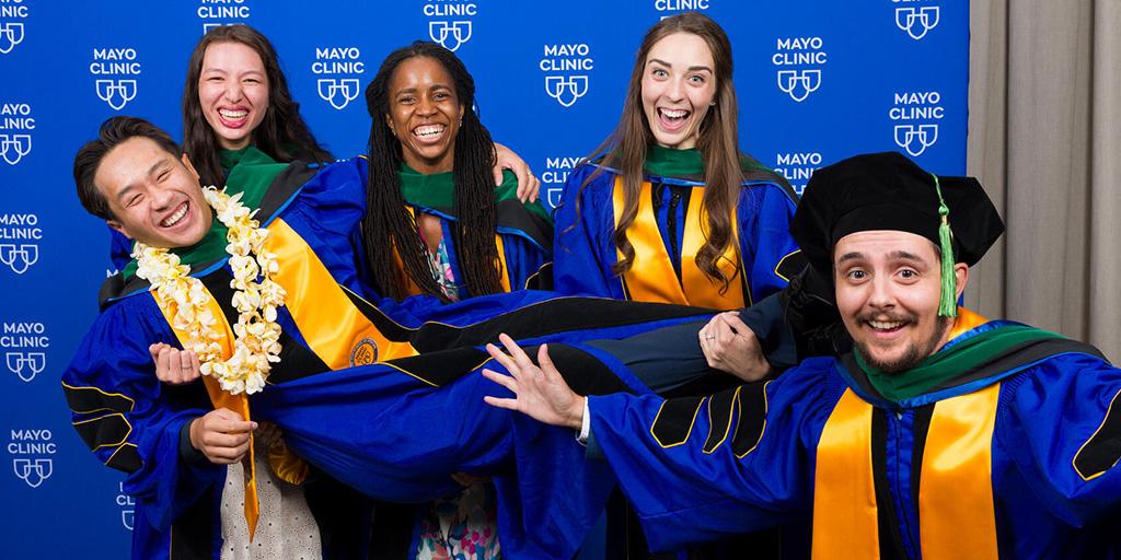 Arizona graduates smile, laugh, and pose for the camera after 2025 Commencement