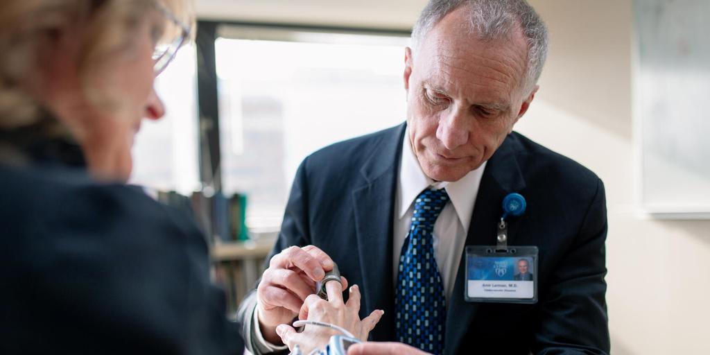 Amir Lerman, M.D., works with a patient at Mayo Clinic