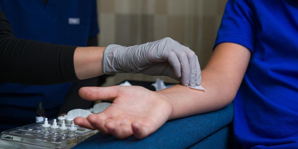 Mayo Clinic staff performs allergy testing on a pediatric patient