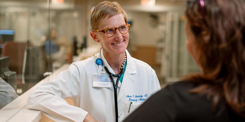Anne Sadosty, M.D. speaks with a colleague at Mayo Clinic