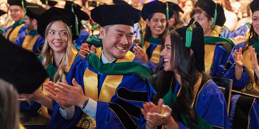2026 graduates smile and talk during Mayo Clinic Commencement ceremonies in Arizona