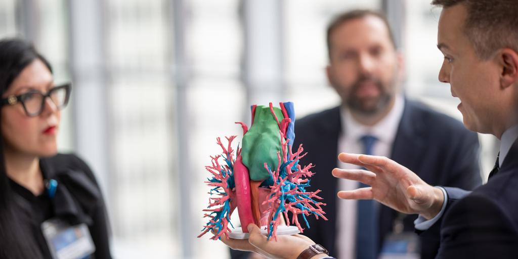 David Sanborn, M.D., holds and speaks about a 3D model with other transplant medicine colleagues at Mayo Clinic