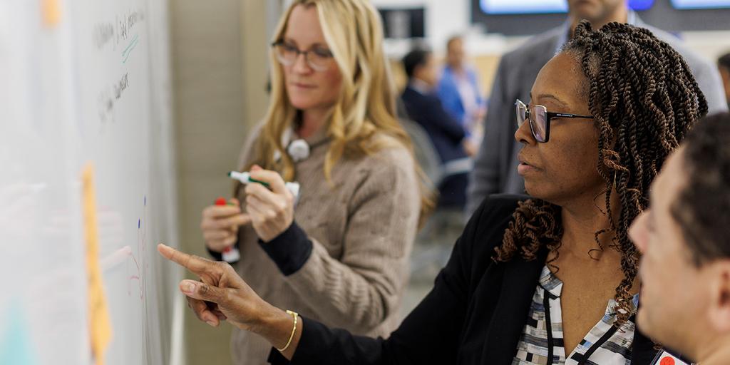 Participants working on medical innovations during the Biodesign Innovation Workshop.