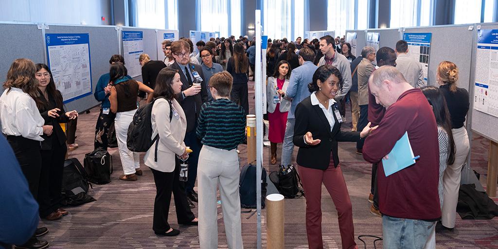 Attendees gather and view poster presentations during the 2026 Mayo Clinic Graduate School of Biomedical Sciences (MCGSBS) Student Research Symposium.