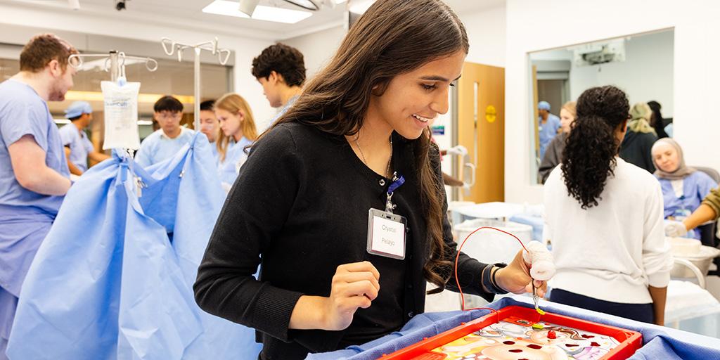 A participant in the Career Immersion Program at Mayo Clinic plays a simulation game