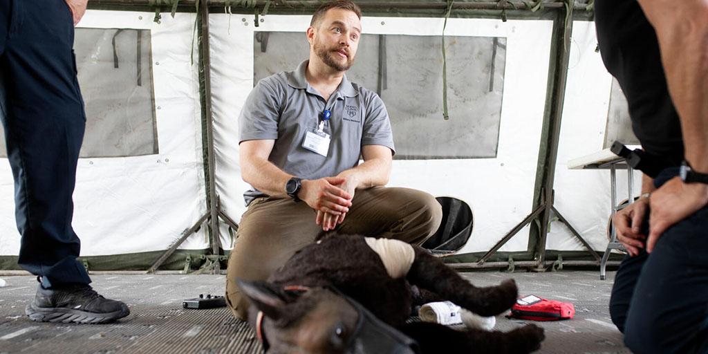 Jessie Milaski, Military Medicine Program instructor, providing canine trauma training to first responders using a K9 Diesel dog-like simulator.