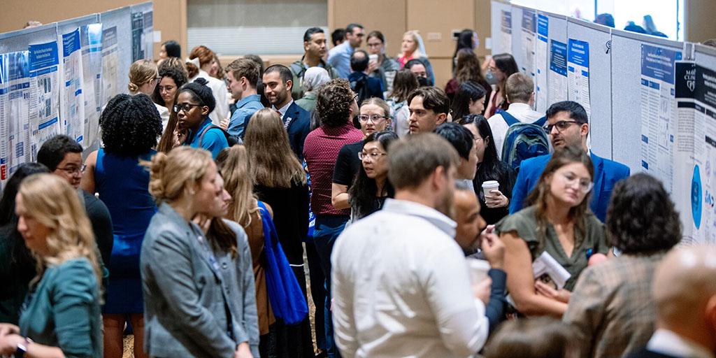 Crowds of students and faculty celebrate research at the 2023 Research Symposium