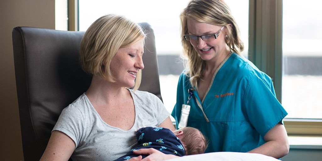 A Mayo Clinic nurse midwife with a patient and her newborn baby.