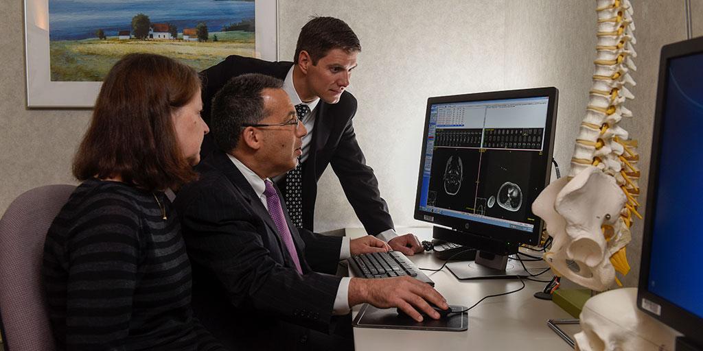 Mayo Clinic neurosurgeon reviewing radiology results with fellows