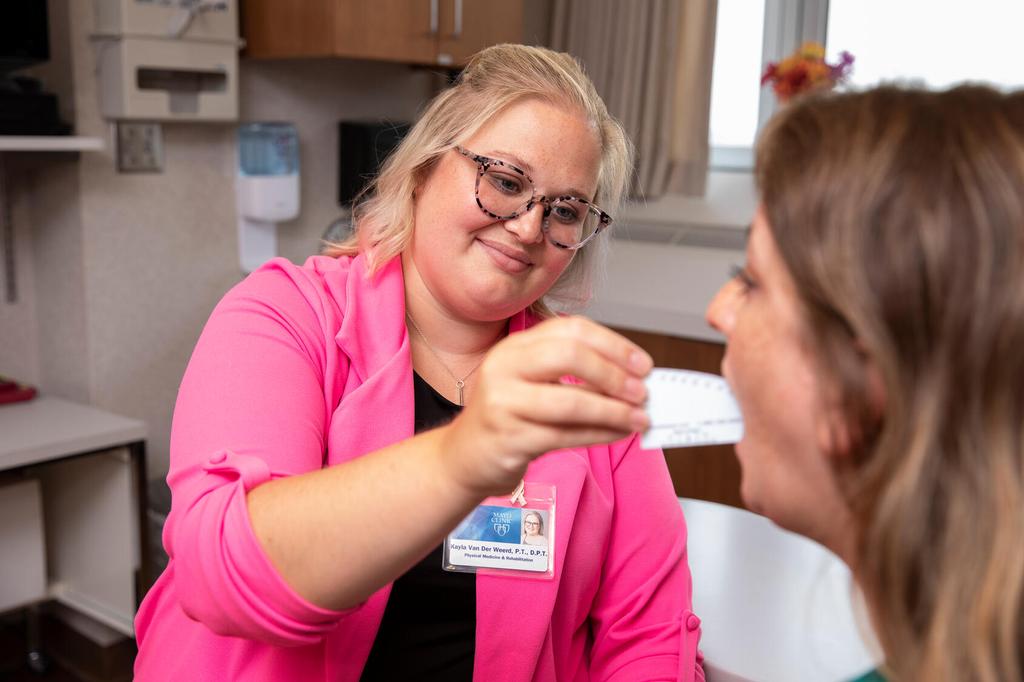 A doctor working with a patient.