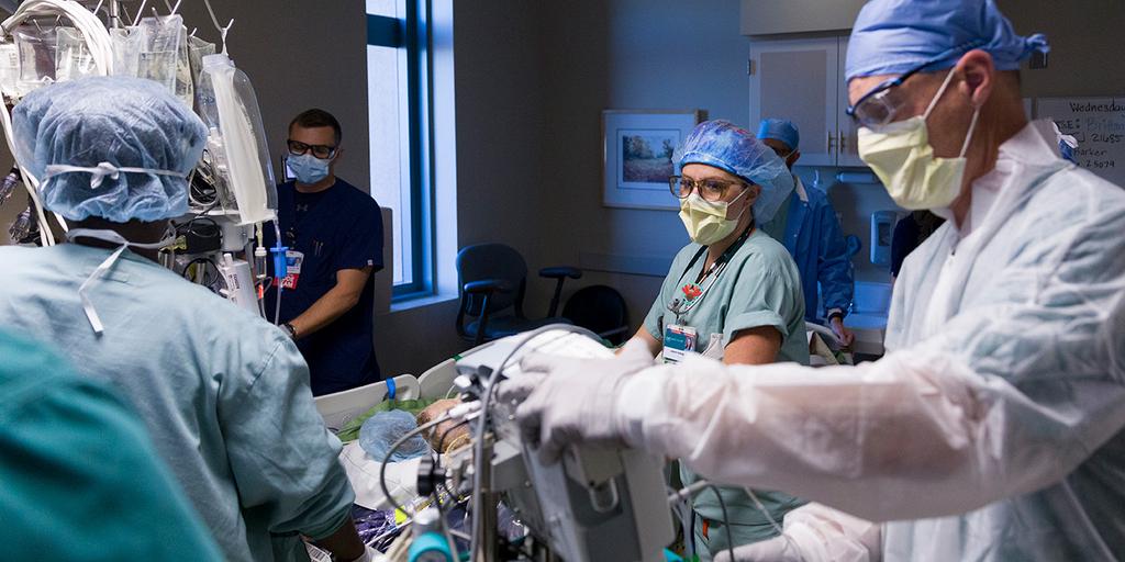 Critical care NPPA fellows and doctors work on a patient in the operating room at Mayo Clinic