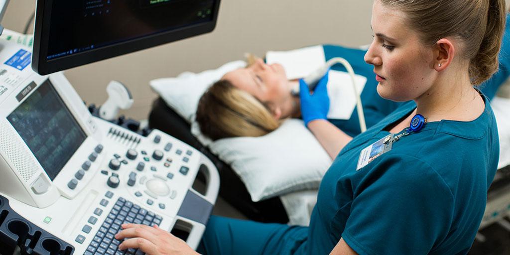 Sonography student performing an ultrasound
