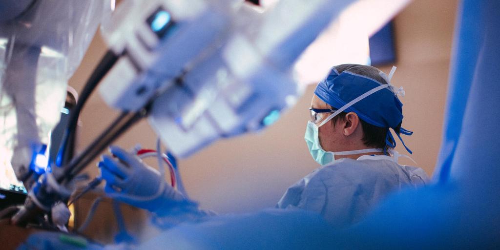 Surgical assistant uses a robot to assist in a surgery at Mayo Clinic