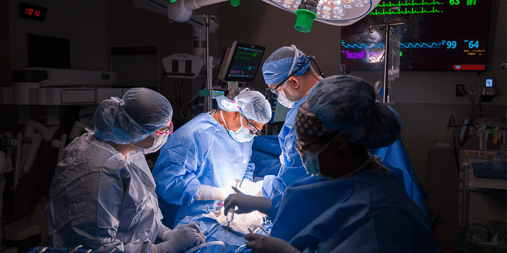 Surgeons focusing down toward the surgical field