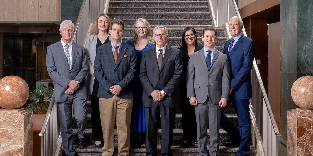 Lung transplant physicians, surgeons, advanced practice providers, and staff pose together for a group photograph.