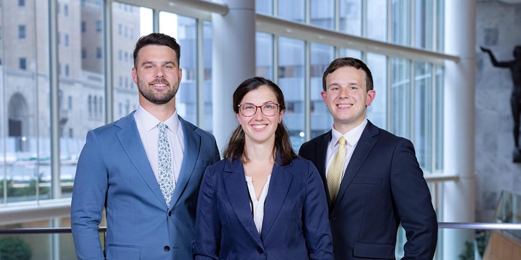 Three fellows in the Adult Reconstructive Surgery - Lower Extremities program pose for a group photo.