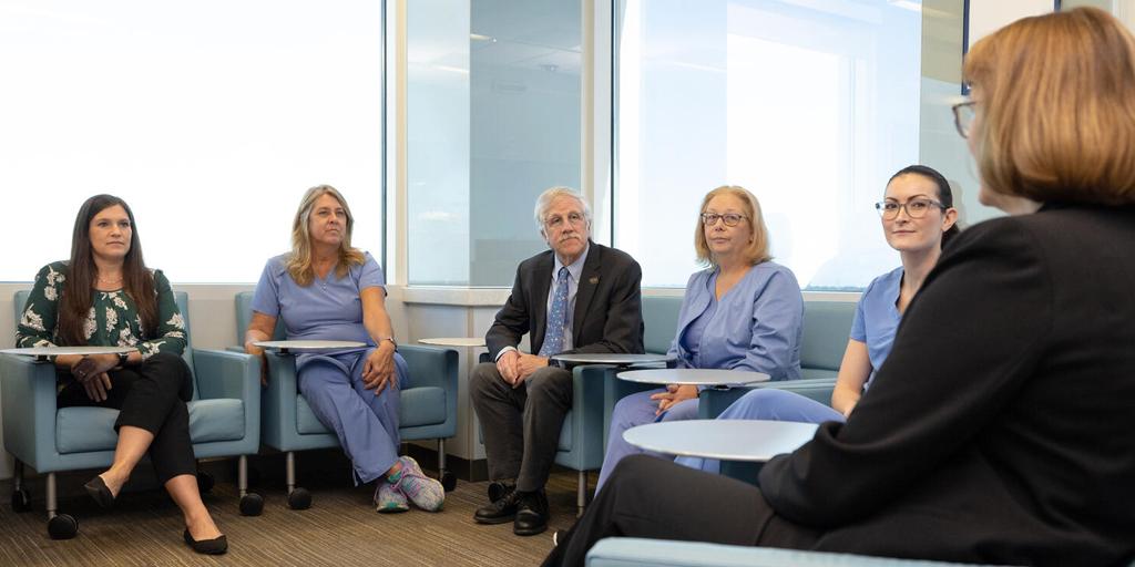 Six people from the Advanced Inflammatory Bowel Disease Fellowship program at Mayo Clinic in Jacksonville, Florida, held a discussion in a conference room.