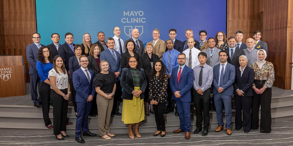 Faculty members in the program pose for a large group shot.