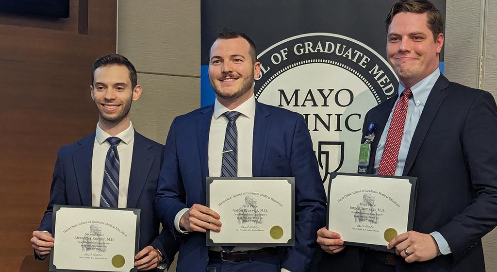 Dr. Roesler, Dr. Brussels, and Dr. Sumsion (left to right) receiving awards for the research presentations at Mayo Academic Excellence Day 2024.