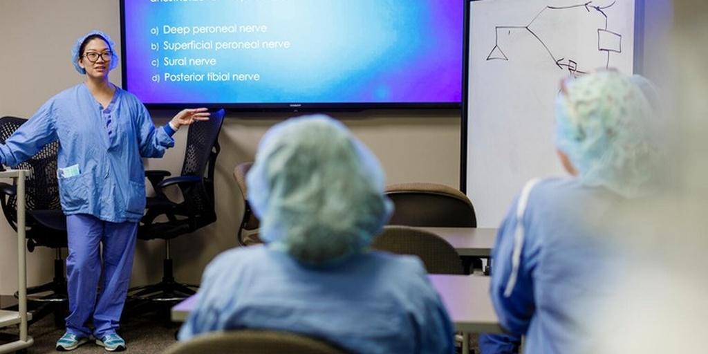 Residents listen to a lecture in a classroom