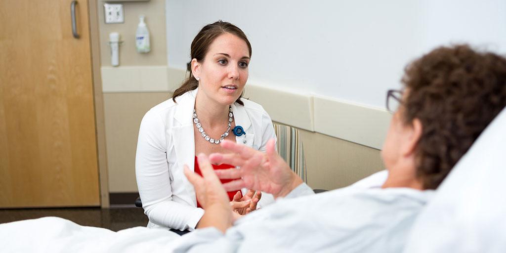 A Mayo Clinic anesthesiologist listening to a patient