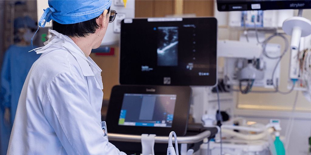 An anesthesiology resident performing an ultrasound