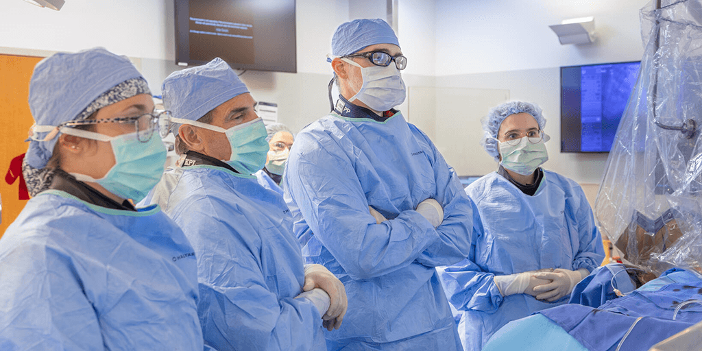 Interventional cardiologists performing a procedure in the catheterization (cath) lab.