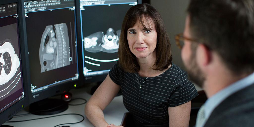 Mayo Clinic cardiothoracic radiologist reviews an imaging scan on a computer monitor with a fellow in Rochester, Minnesota.