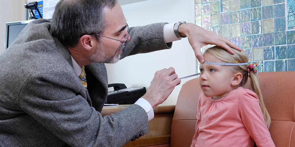 Dr. Patterson examining a young patient