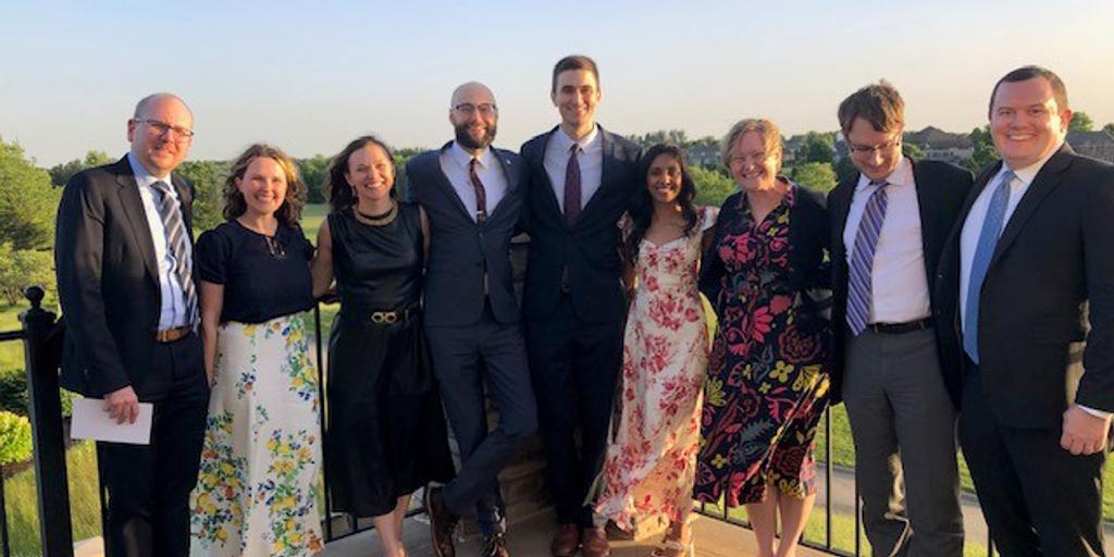 2024 faculty and graduates pose for a photo at Somerby Golf Course.