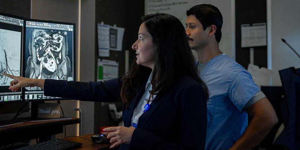 Residents reviewing scans in radiology reading room