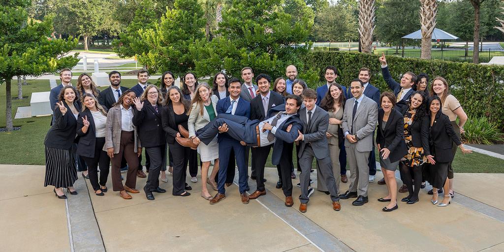 Members of the Diagnostic and Interventional Radiology Residency group pose together for a photograph outside.