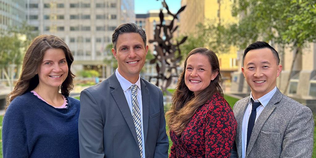 Outdoor formal group portrait of four people from the Diagnostic Radiology Residency at Mayo Clinic in Rochester, Minnesota.