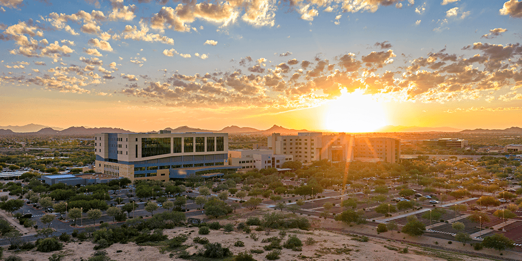 The main Phoenix campus buildings are shown at sunrise