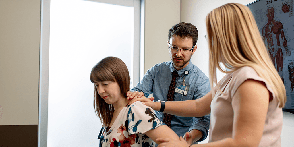 Family medicine fellows with a patient