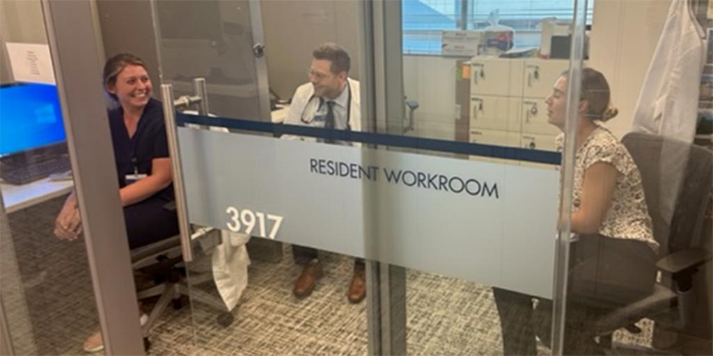 Three residents in one of the resident workrooms at Mayo Clinic in Florida.
