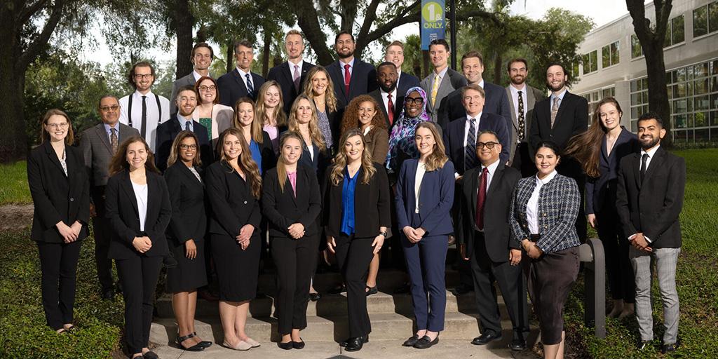 The Family Medicine Residency class of 2024 poses together with Department of Family Medicine consultants.