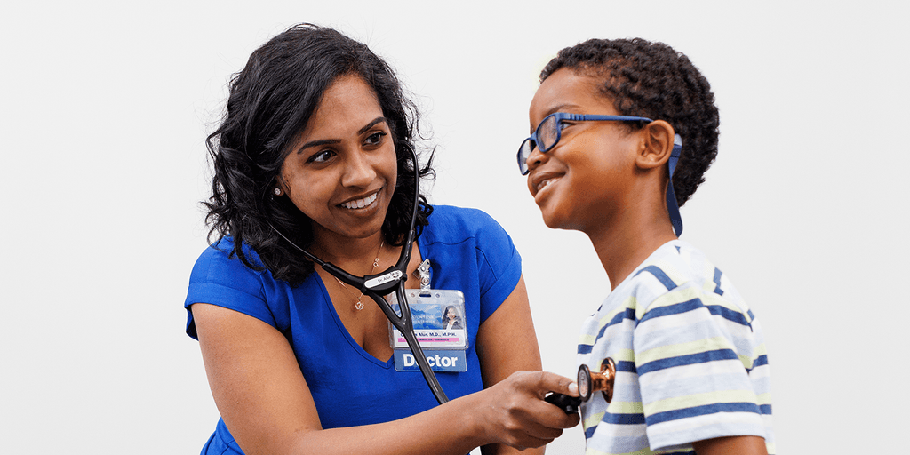 A Family Medicine resident with a young patient