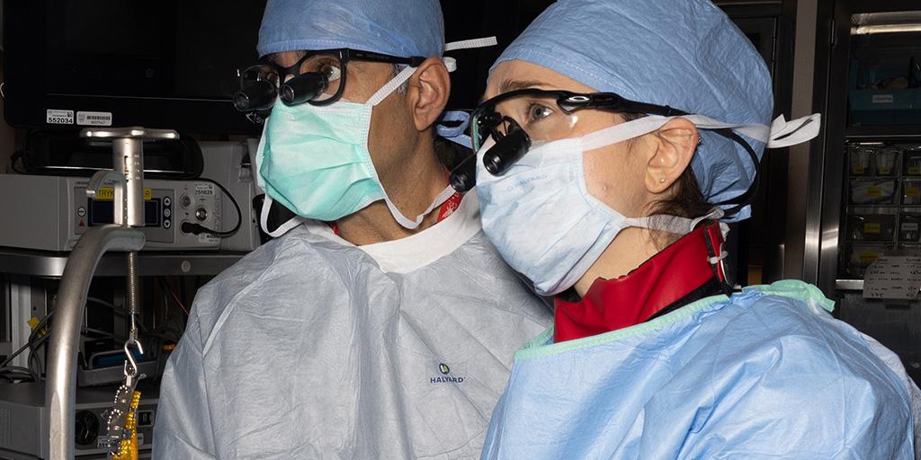 Two hand surgery fellows in scrubs