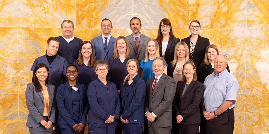 aculty and staff in the Headache Division of the Department of Neurology in Rochester pose together.