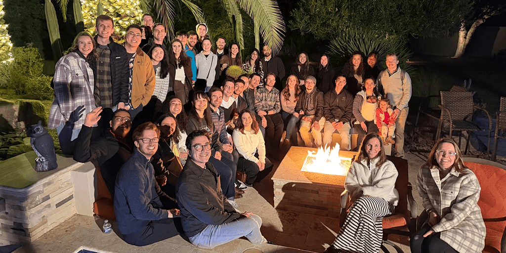 Residents at a dinner and bonfire