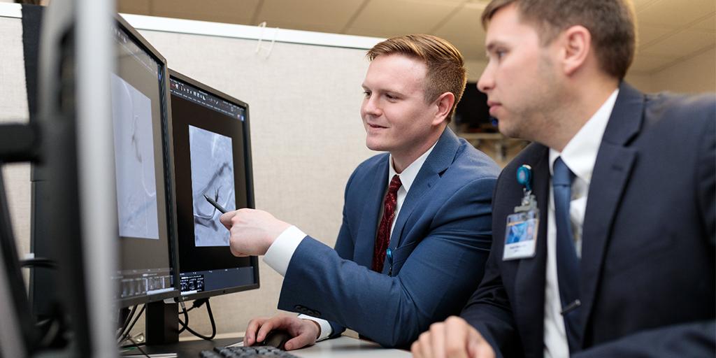 Interventional radiology resident and faculty member look at a scan together at Mayo Clinic in Rochester, Minnesota.
