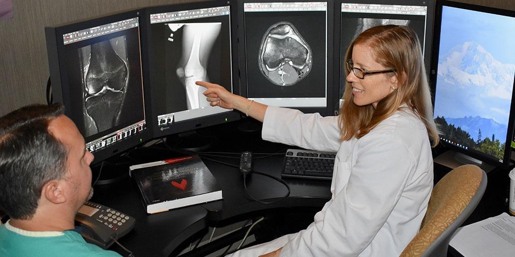 Musculoskeletal fellow looks at imaging scans at Mayo Clinic.