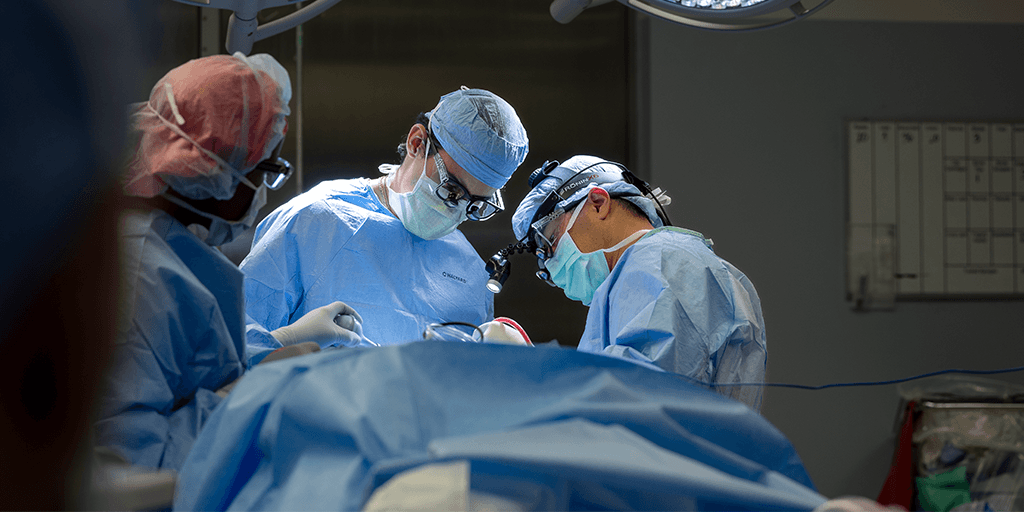 Neurologic surgery residents in a procedure