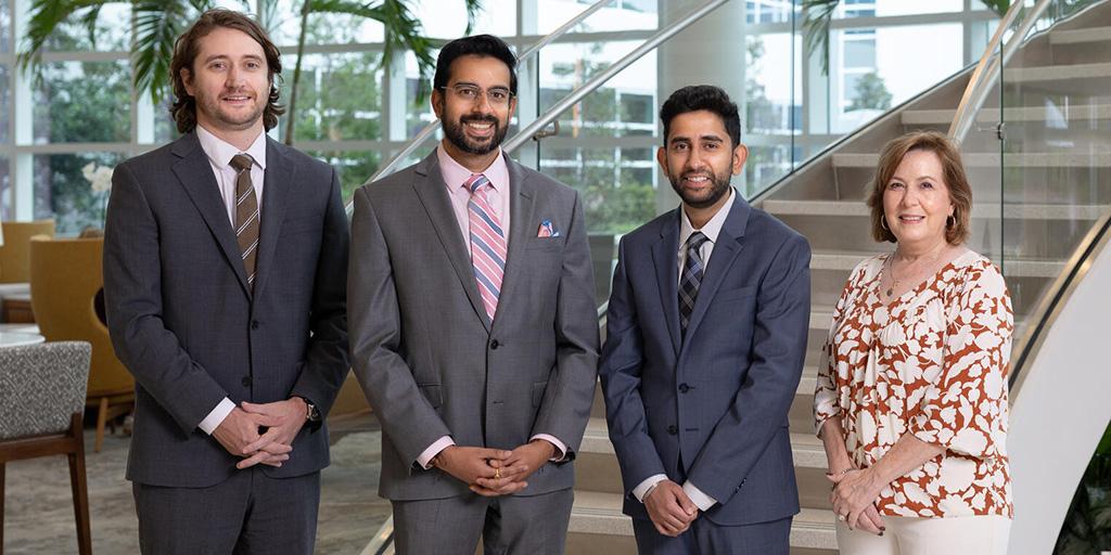 Four people from the Neuroradiology Fellowship program in Jacksonville, Florida, pose for a group photo.