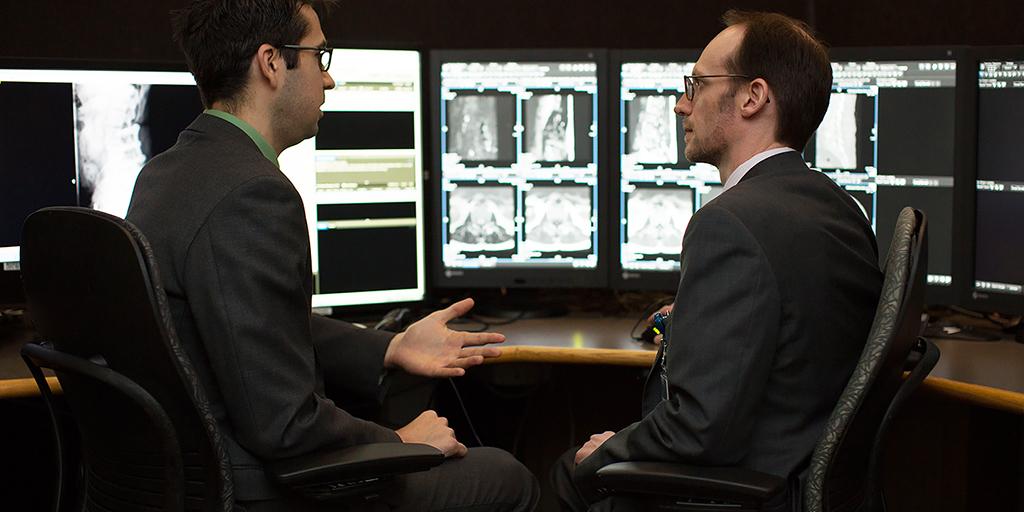 Mayo Clinic neuroradiology fellow and faculty member reviewing images