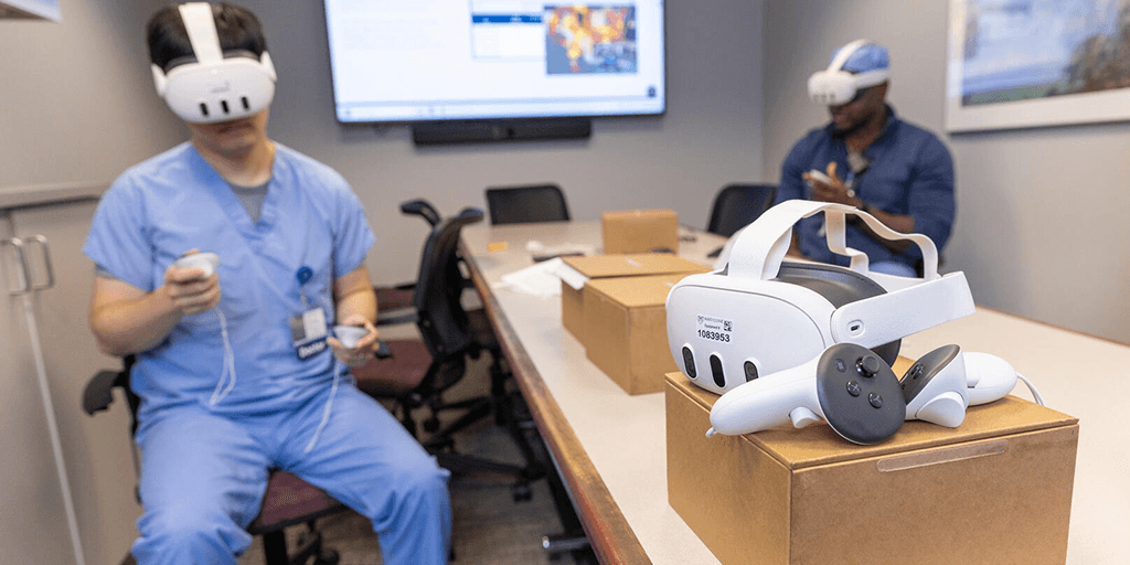 Two fellows working with virtual reality equipment