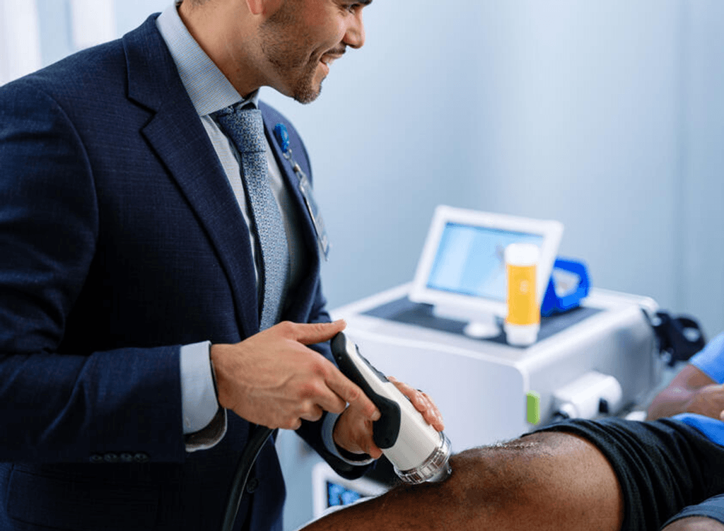 Physician performing procedure on patient.