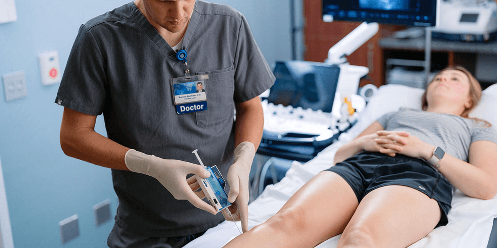 Physician performing procedure on patient.